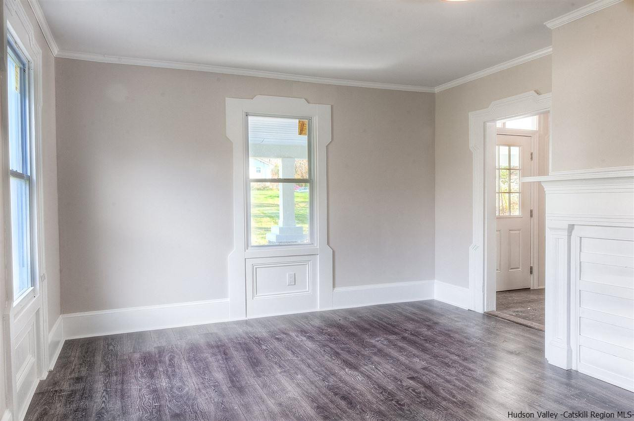455 Plattekill Ardonia Road Wallkill, NY 12589 - Photo 8 of 24 an empty room with wooden floor and a window