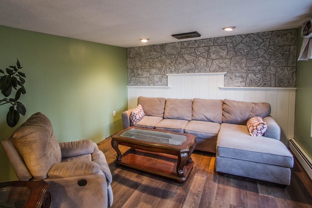 116 Oakham Road Barre, MA 01005 - Photo 3 of 21 a living room with furniture and a couch