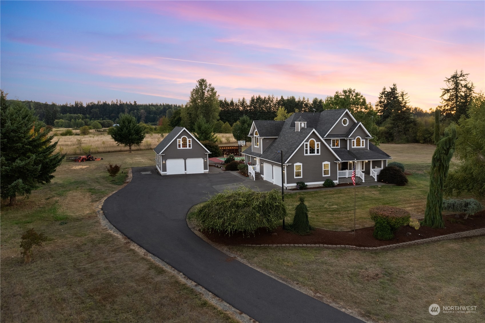 a house with green field in front of it
