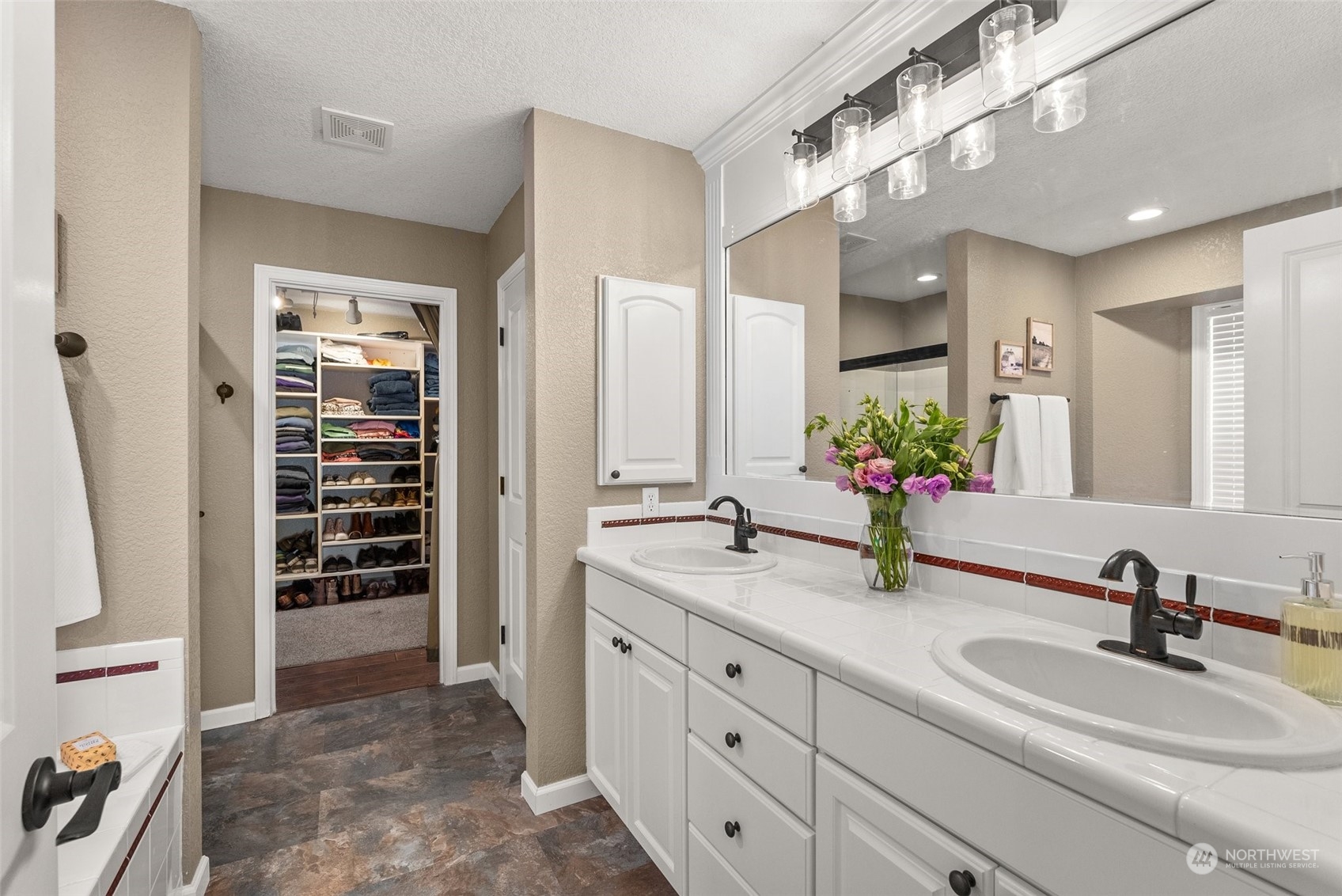 10909 188th Avenue Southwest Rochester, WA 98579 - Photo 20 of 40 a bathroom with a granite countertop sink and a mirror