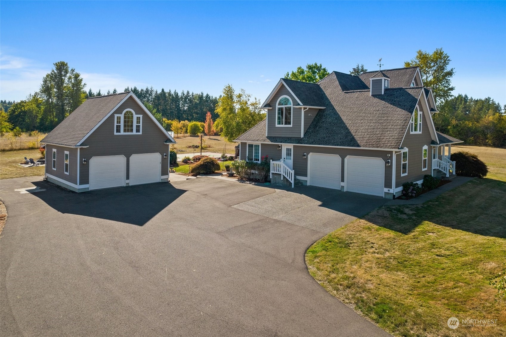 10909 188th Avenue Southwest Rochester, WA 98579 - Photo 5 of 40 a front view of a house with a yard