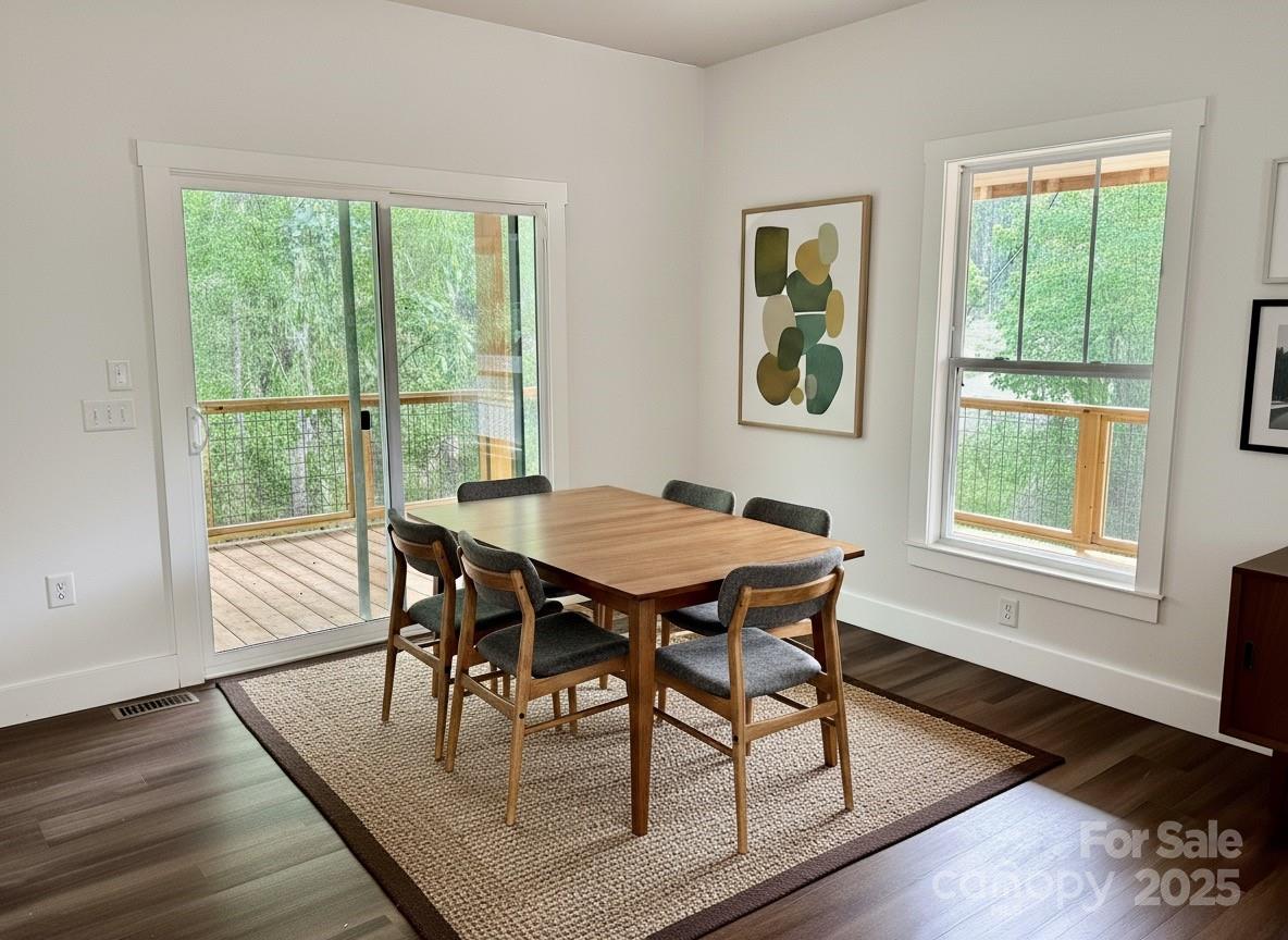 206 Cascade Rdg Road Fairview, NC 28730 - Photo 12 of 38 a dining room with furniture and wooden floor