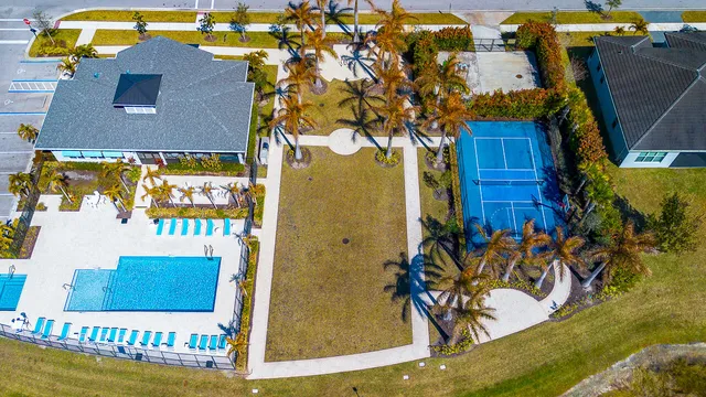 an aerial view of a house with a swimming pool
