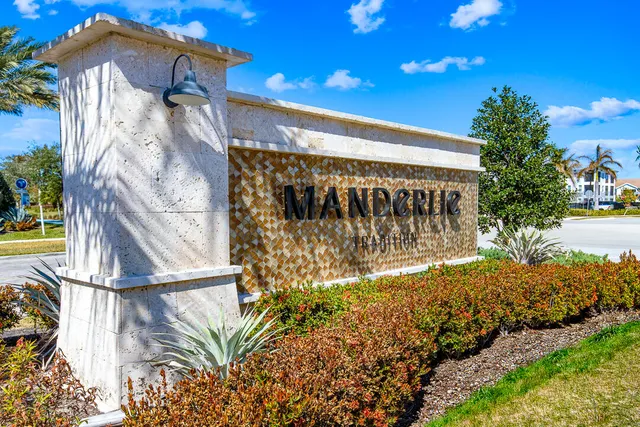 a view of a pathway of a house with a yard