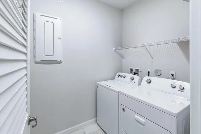 a view of a kitchen with a sink and a refrigerator