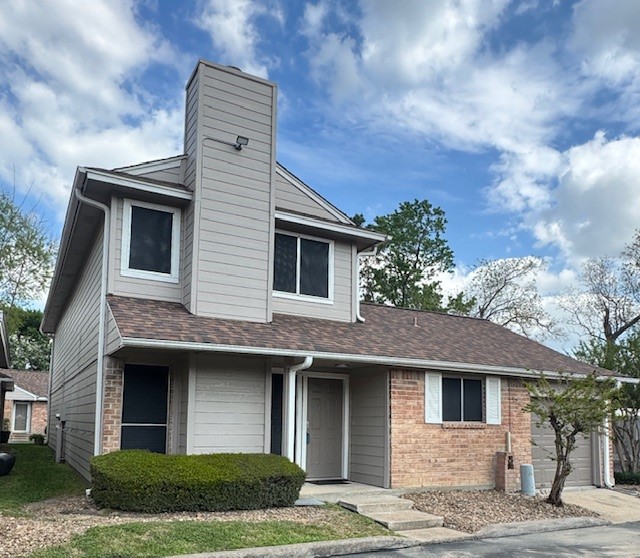 14020 Schroeder Road, Unit 151 Houston, TX 77070 - Photo 26 of 26 a front view of a house with garden