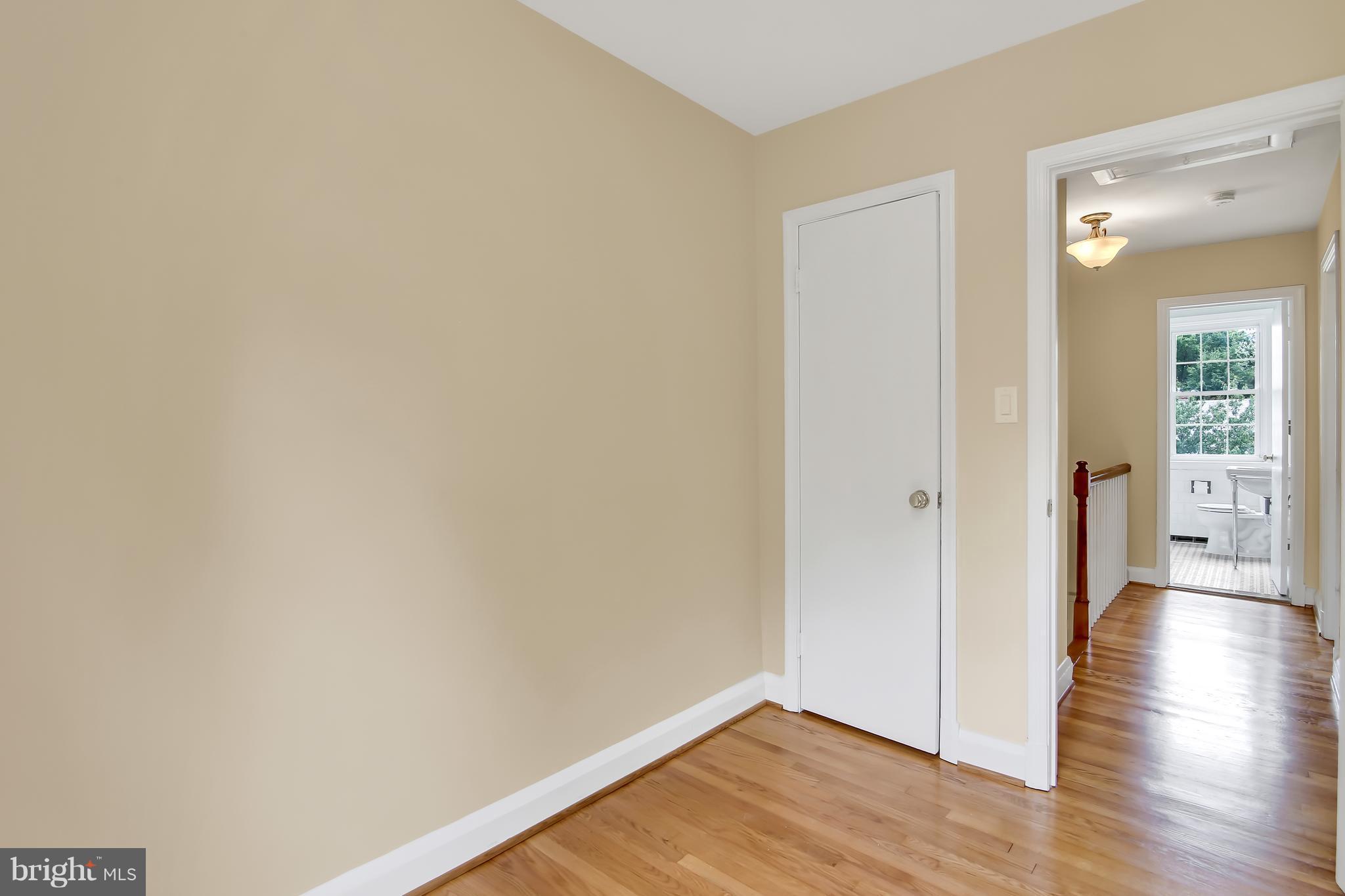 7134 Heathfield Road Baltimore, MD 21212 - Photo 13 of 28 a view of a hallway with wooden floor
