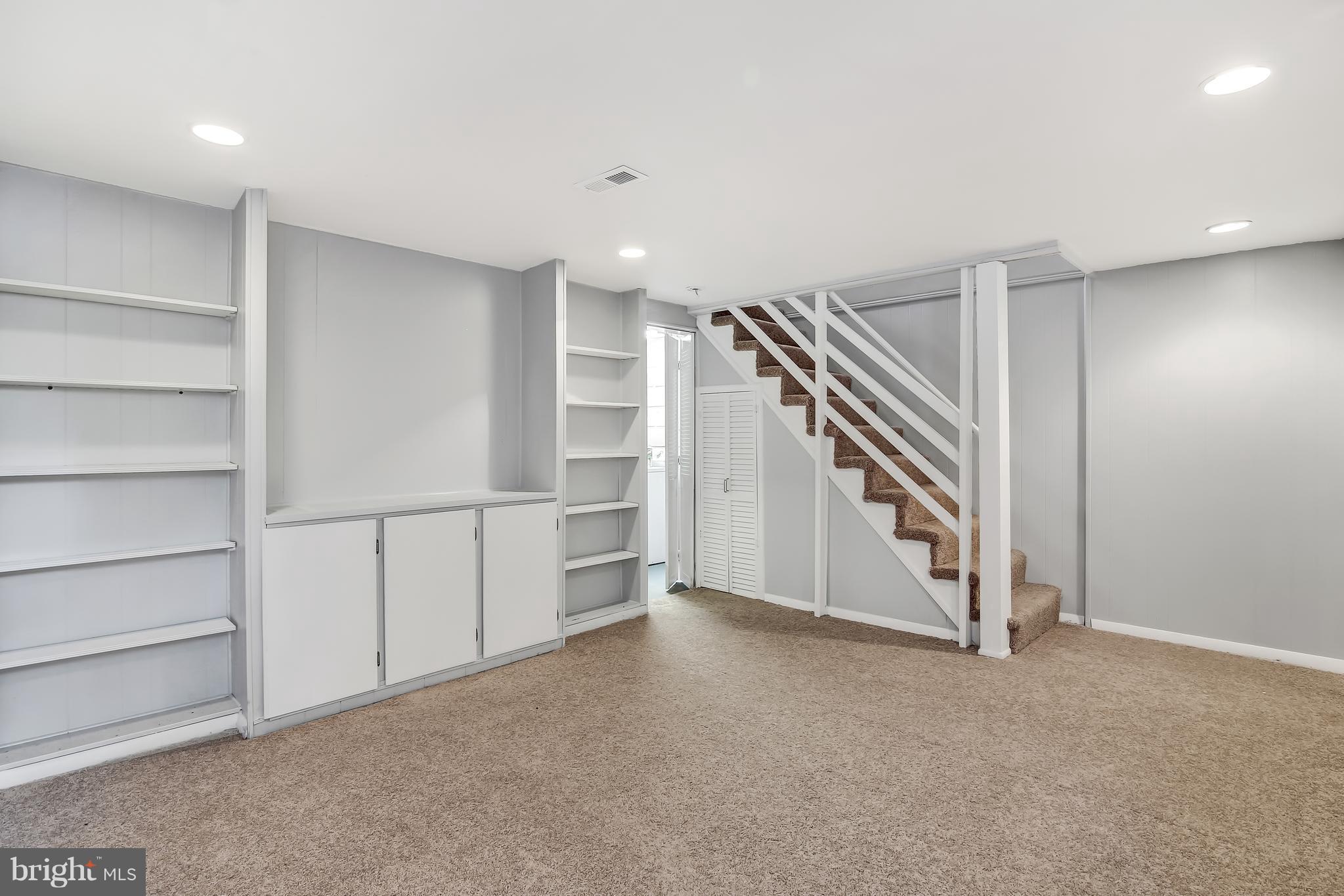 7134 Heathfield Road Baltimore, MD 21212 - Photo 23 of 28 a view of an empty room with stairs