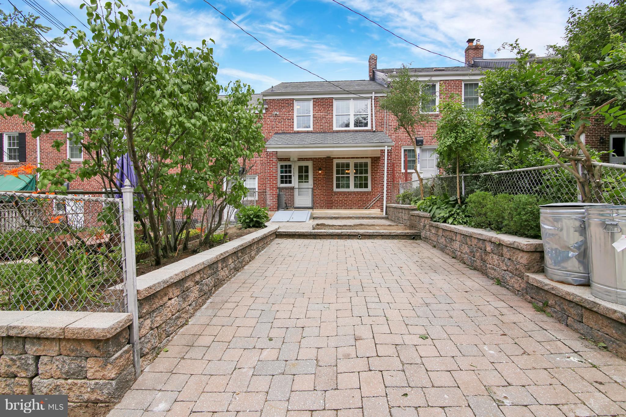 7134 Heathfield Road Baltimore, MD 21212 - Photo 24 of 28 a front view of a house with a garden