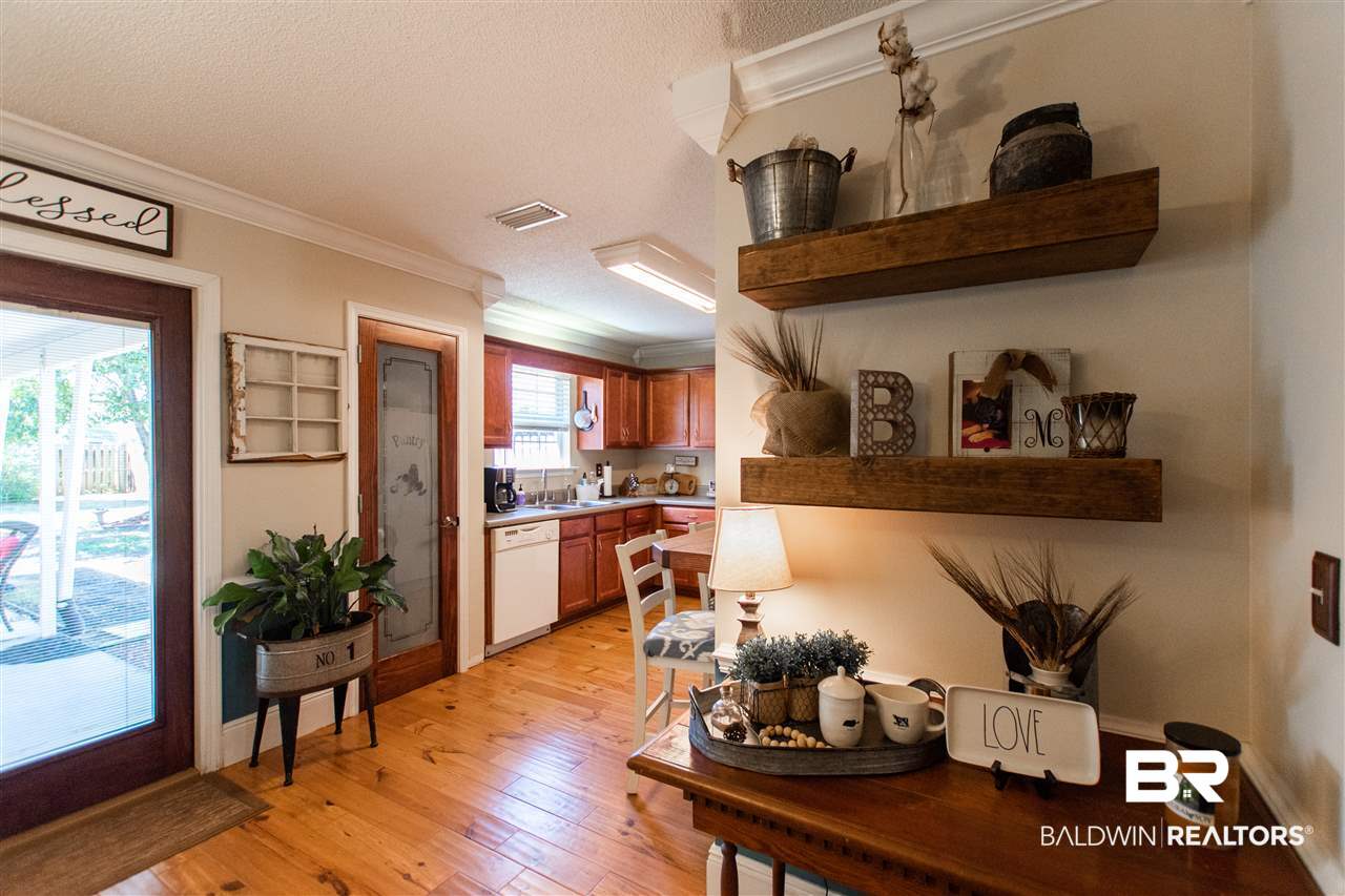 28119 Landmark Avenue Loxley, AL 36551 - Photo 9 of 47 check out glass door to panty and all the shelves
