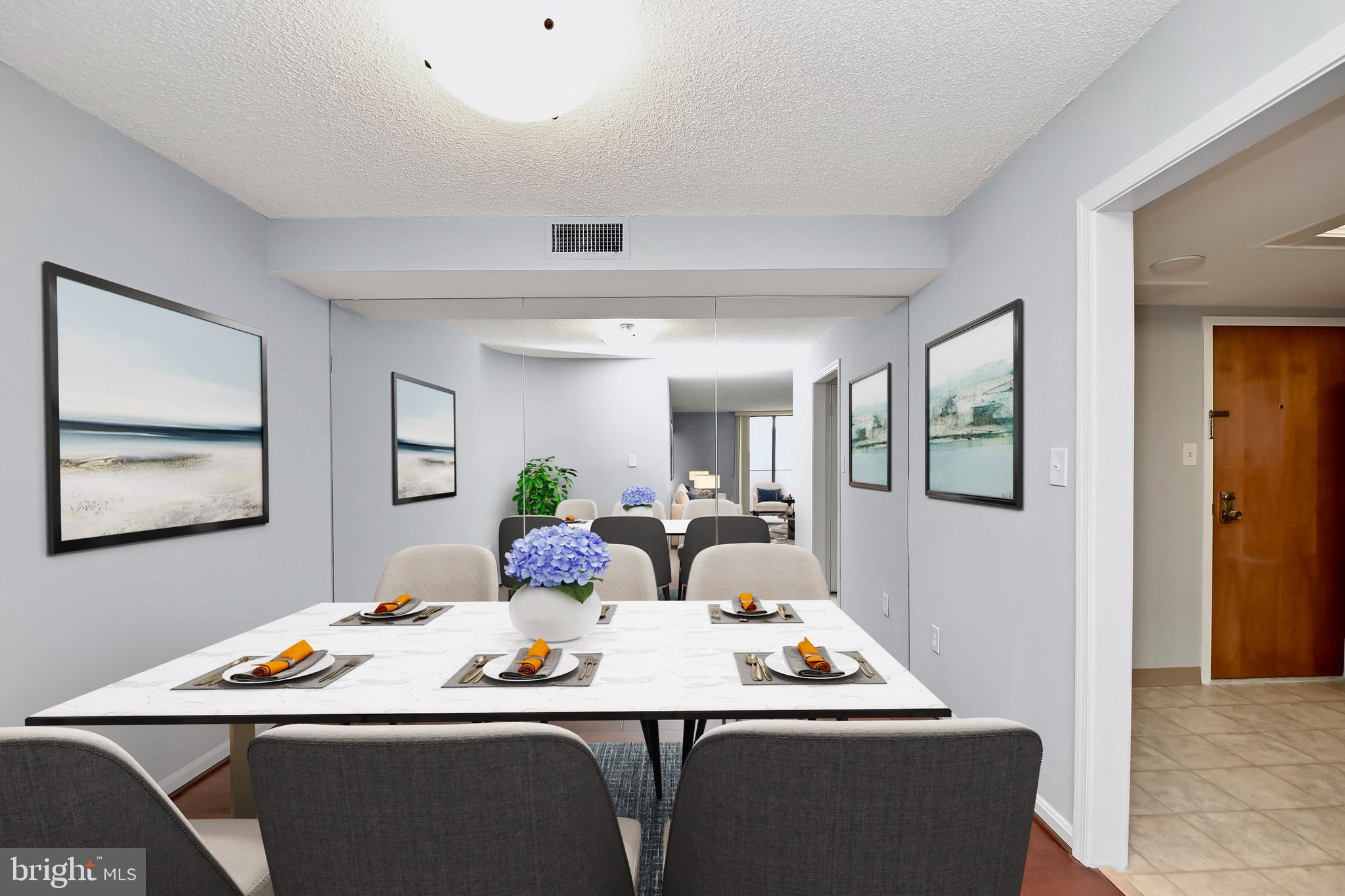 1101 South Arlington Ridge Road, Unit 509 Arlington, VA 22202 - Photo 16 of 62 a dining room with a table and chairs