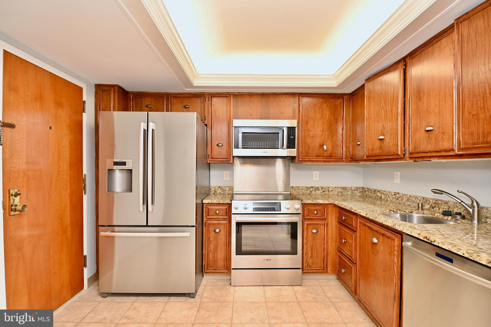 1101 South Arlington Ridge Road, Unit 509 Arlington, VA 22202 - Photo 19 of 62 a kitchen with stainless steel appliances granite countertop a refrigerator sink and stove