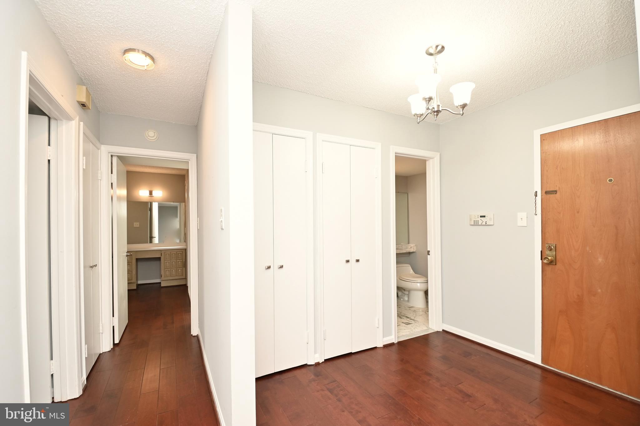 1101 South Arlington Ridge Road, Unit 509 Arlington, VA 22202 - Photo 24 of 62 wooden floor in a hall with an entryway space