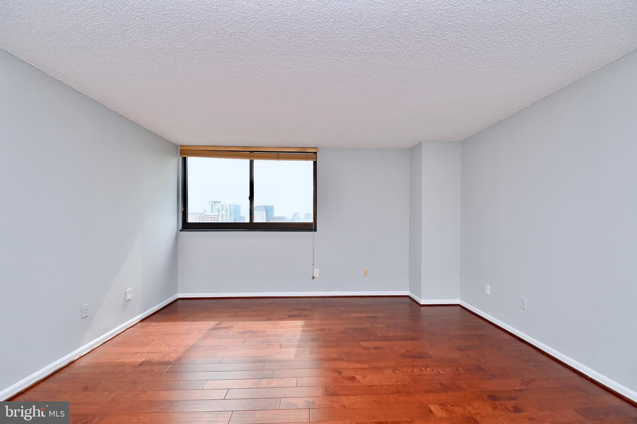 1101 South Arlington Ridge Road, Unit 509 Arlington, VA 22202 - Photo 30 of 62 a view of empty room with wooden floor and fan