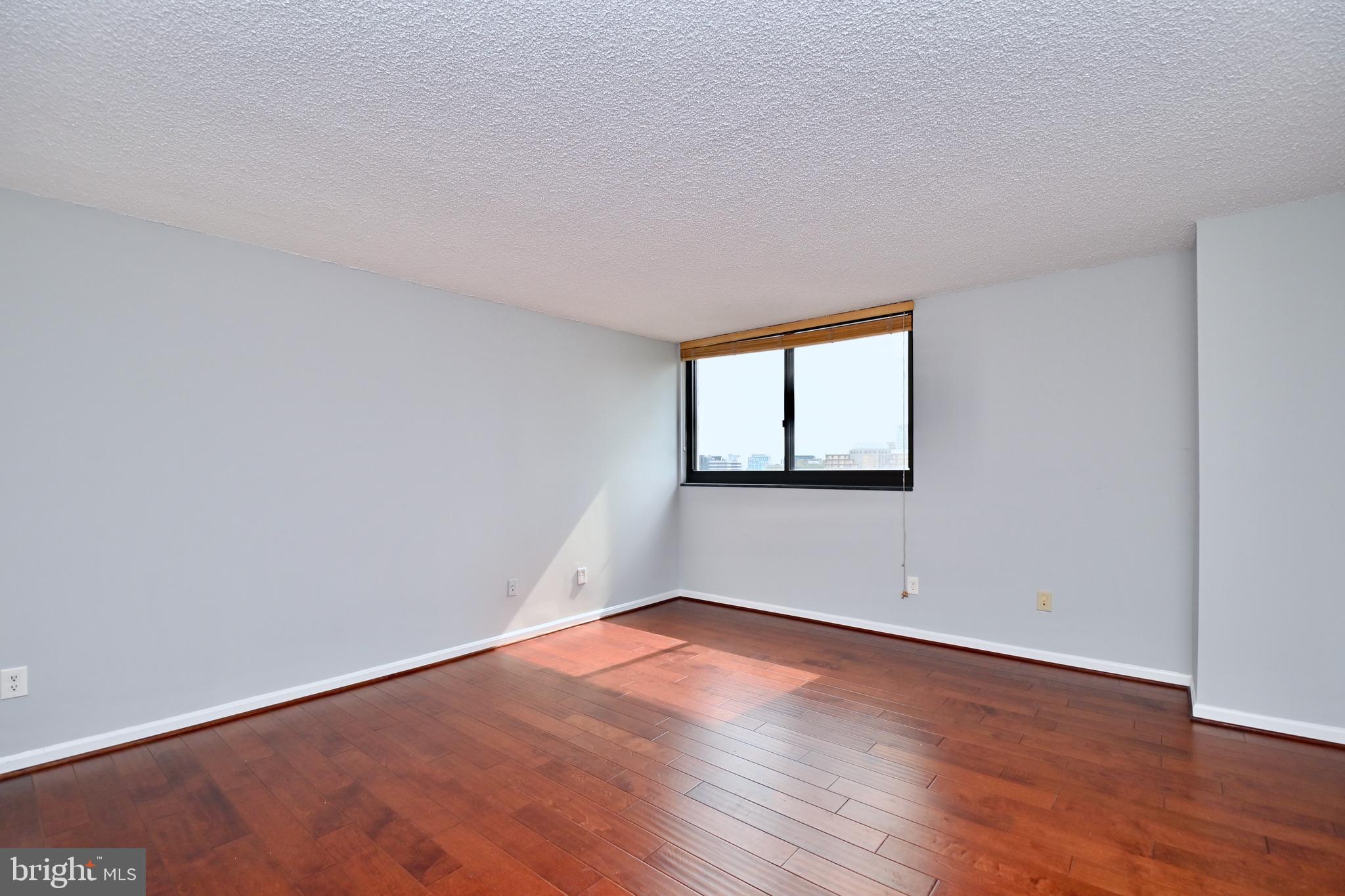 1101 South Arlington Ridge Road, Unit 509 Arlington, VA 22202 - Photo 31 of 62 a view of empty room with wooden floor and fan