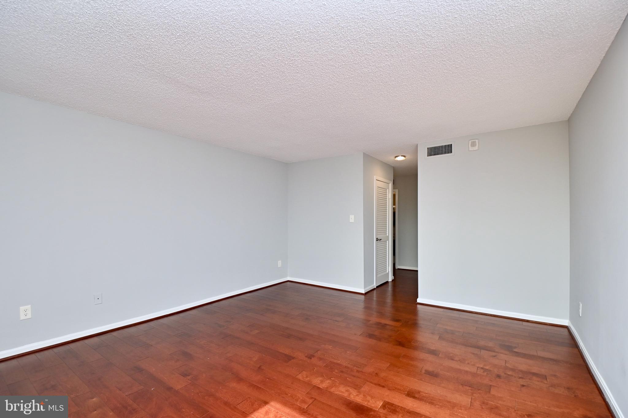 1101 South Arlington Ridge Road, Unit 509 Arlington, VA 22202 - Photo 32 of 62 a view of an empty room and wooden floor