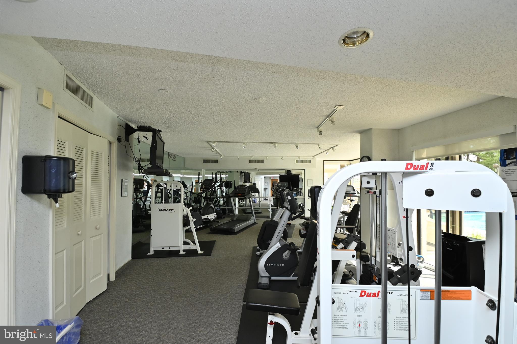 1101 South Arlington Ridge Road, Unit 509 Arlington, VA 22202 - Photo 48 of 62 a view of a room with gym equipment