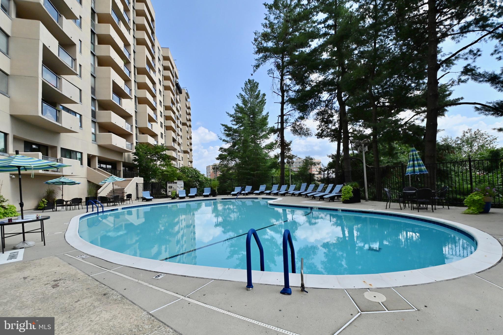 1101 South Arlington Ridge Road, Unit 509 Arlington, VA 22202 - Photo 50 of 62 a view of a swimming pool and sitting area