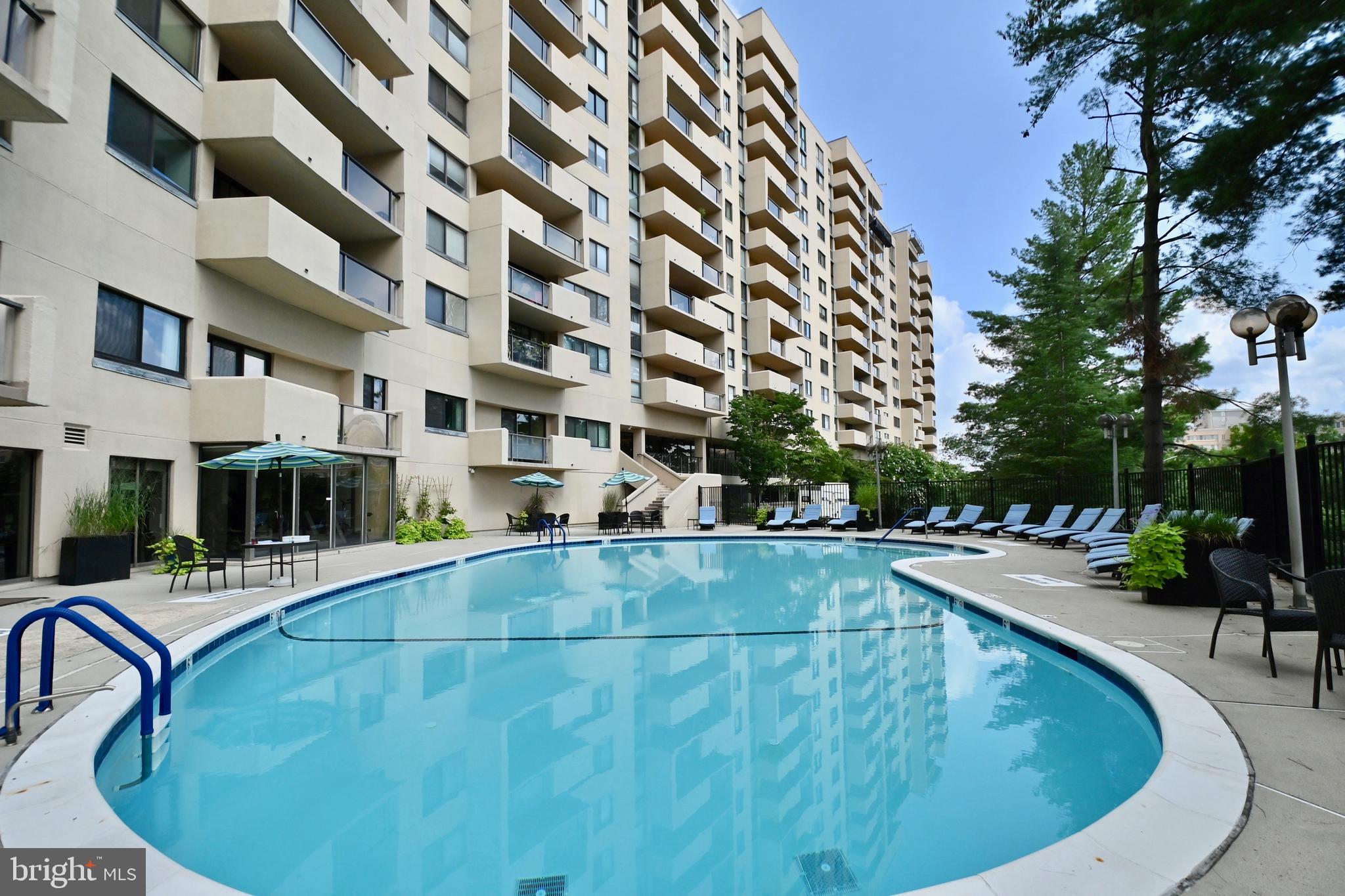 1101 South Arlington Ridge Road, Unit 509 Arlington, VA 22202 - Photo 51 of 62 a view of a swimming pool with a patio