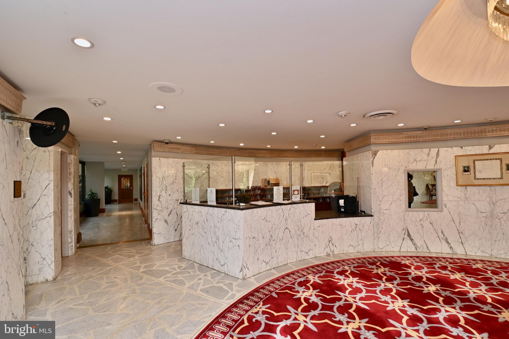1101 South Arlington Ridge Road, Unit 509 Arlington, VA 22202 - Photo 7 of 62 a kitchen with stainless steel appliances kitchen island granite countertop a refrigerator and stove