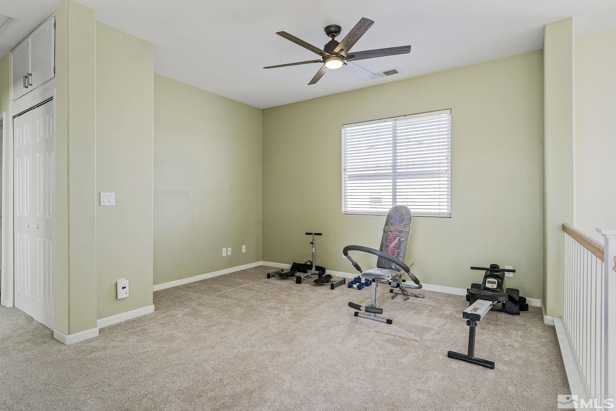 10525 Yuba Court Reno, NV 89521 - Photo 12 of 13 a room with gym equipment and a window