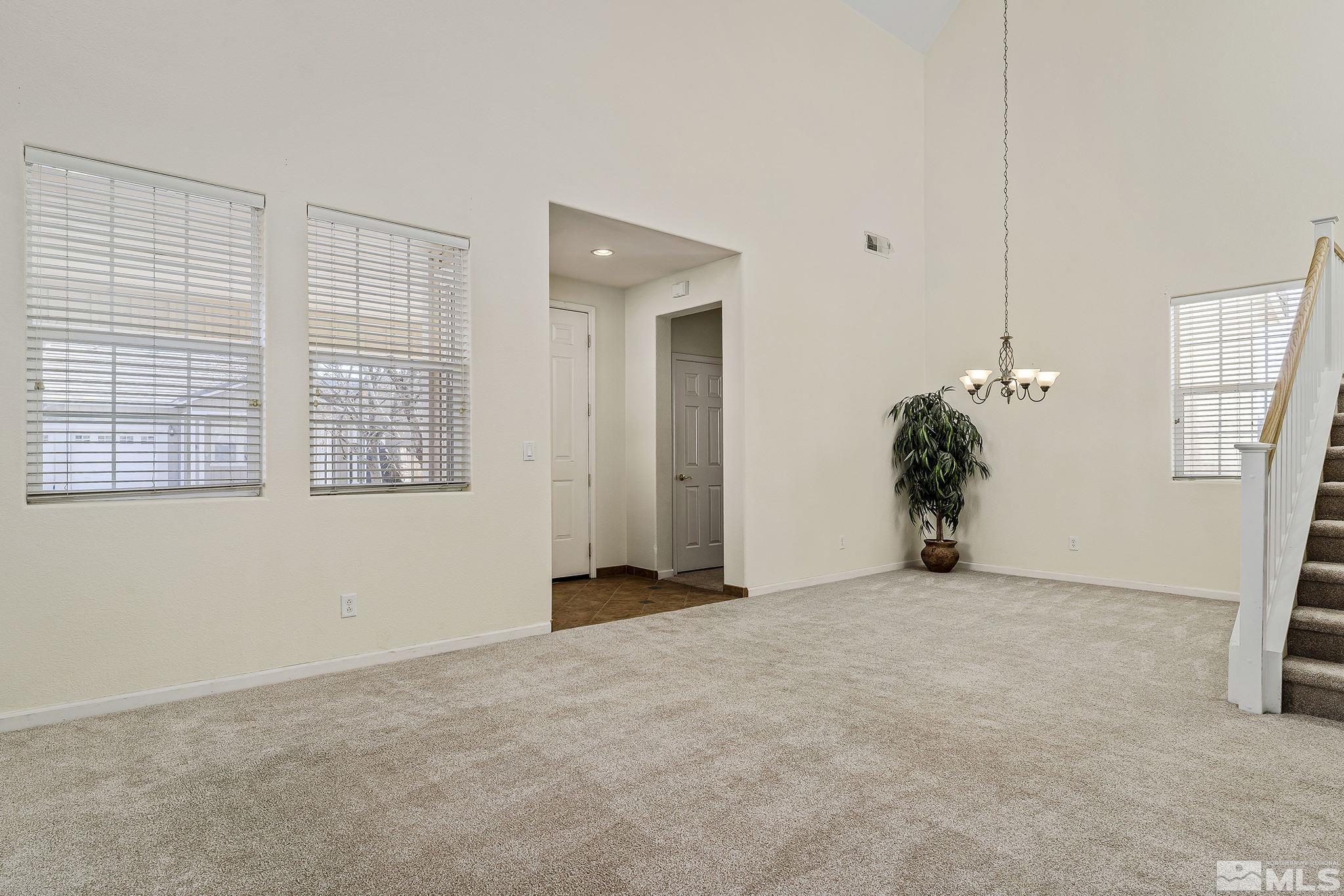 10525 Yuba Court Reno, NV 89521 - Photo 4 of 13 a view of an empty room with a window