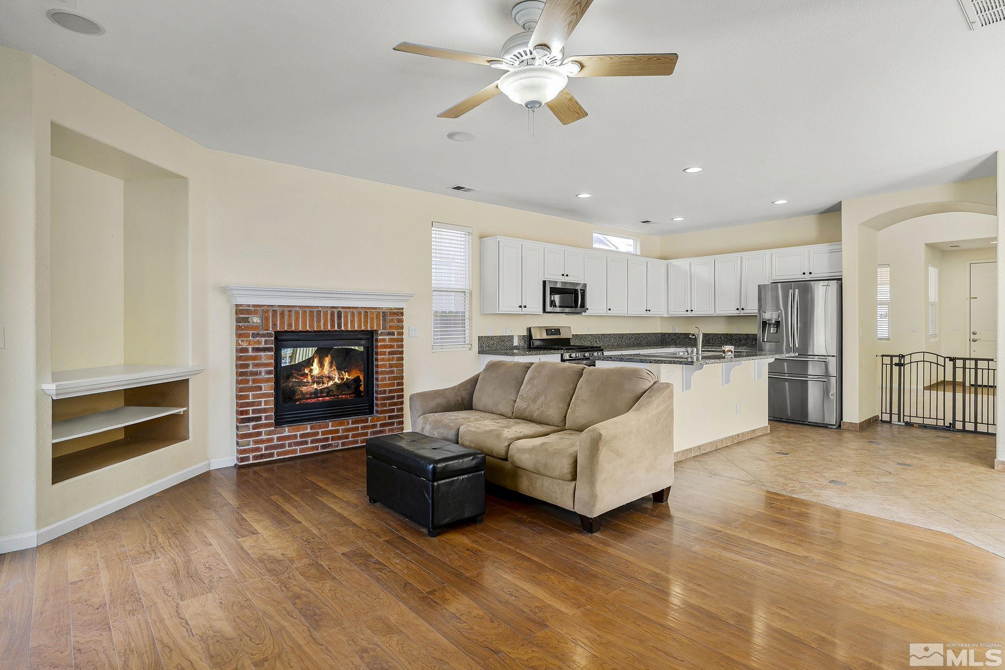 10525 Yuba Court Reno, NV 89521 - Photo 7 of 13 a living room with furniture and a fireplace