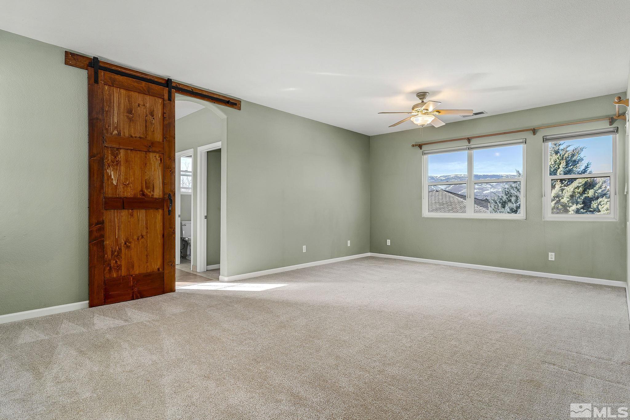 10525 Yuba Court Reno, NV 89521 - Photo 9 of 13 an empty room with windows and closet
