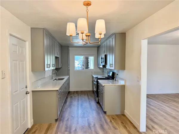 a view of a livingroom with wooden floor