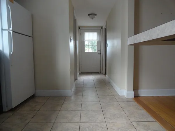 a view of a hallway with closet area