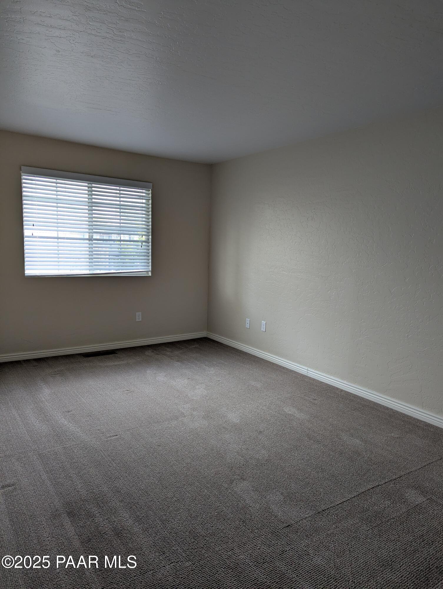 345 South Virginia Street, Unit 1 Prescott, AZ 86303 - Photo 11 of 13 an empty room with a window