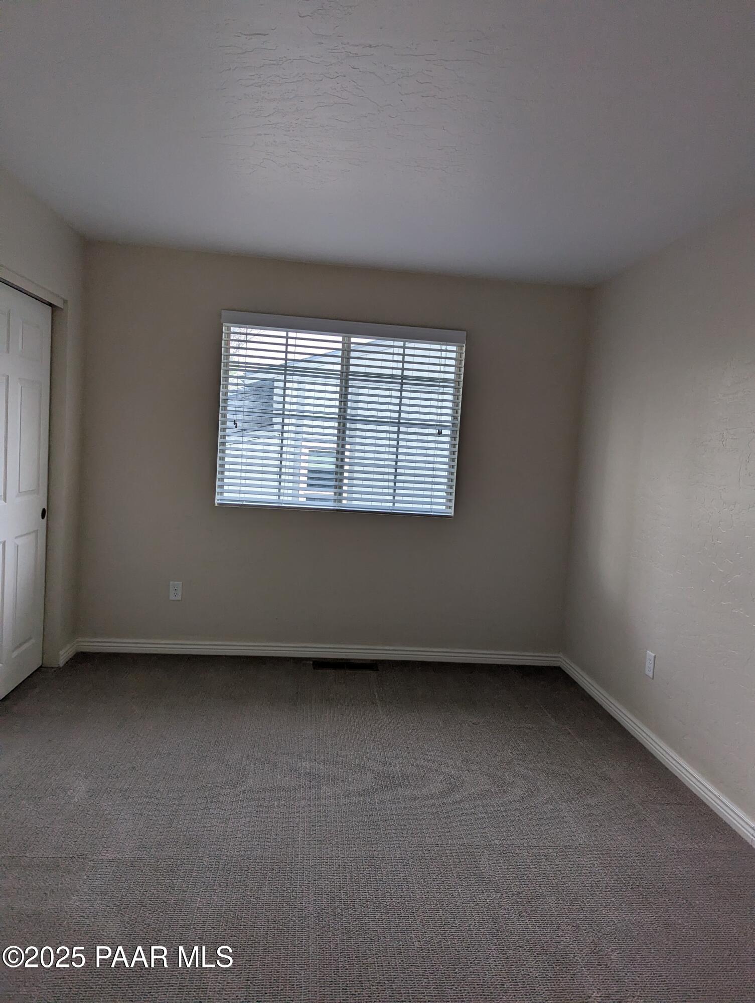 345 South Virginia Street, Unit 1 Prescott, AZ 86303 - Photo 12 of 13 an empty room with a window