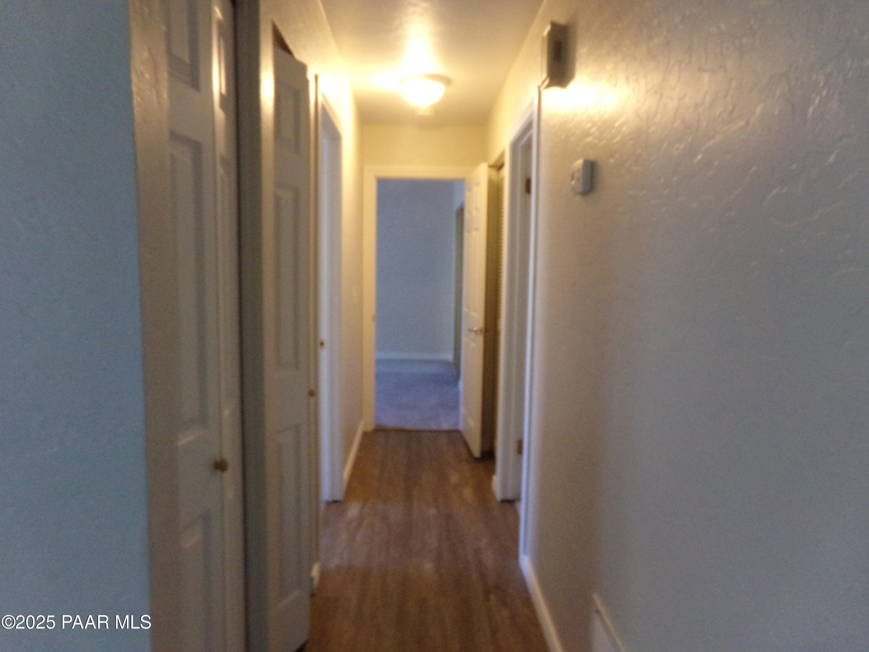 345 South Virginia Street, Unit 1 Prescott, AZ 86303 - Photo 4 of 13 a view of a hallway with wooden floor