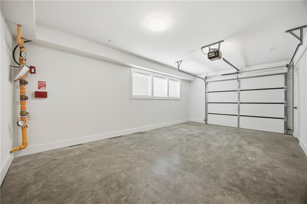 Undisclosed Address Atlanta, GA 30313 - Photo 25 of 35 an empty room with windows and cabinet