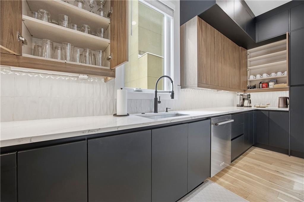 Undisclosed Address Atlanta, GA 30313 - Photo 27 of 35 a kitchen with a sink and cabinets