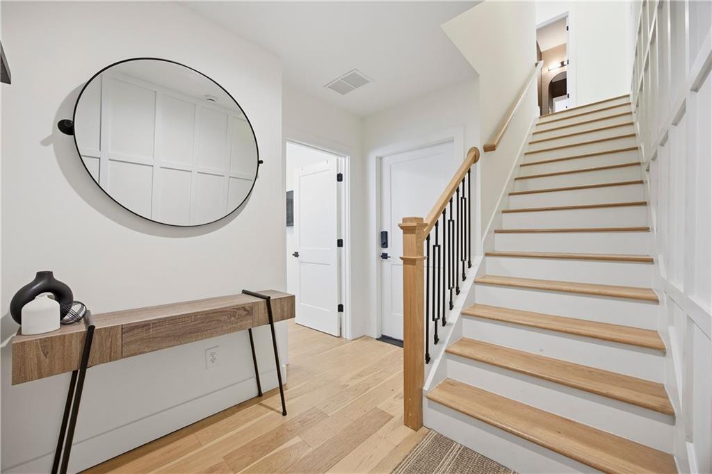 Undisclosed Address Atlanta, GA 30313 - Photo 3 of 35 a view of a hallway with wooden floor and entryway