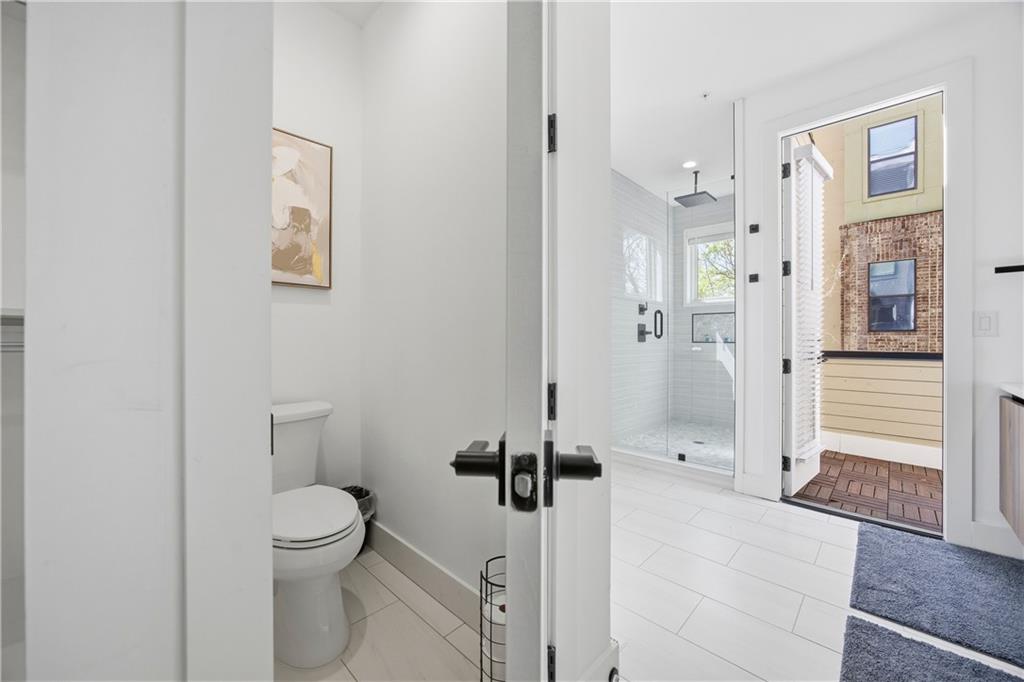 Undisclosed Address Atlanta, GA 30313 - Photo 31 of 35 a bathroom with a toilet and a shower