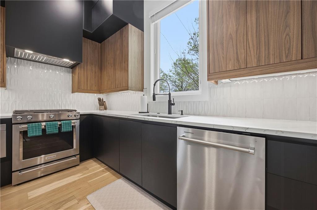 Undisclosed Address Atlanta, GA 30313 - Photo 9 of 35 a kitchen with a sink and cabinets