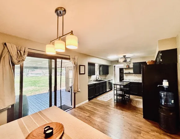 a view of a livingroom with furniture window and wooden floor
