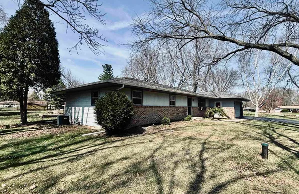 a view of a house with a snow in the yard