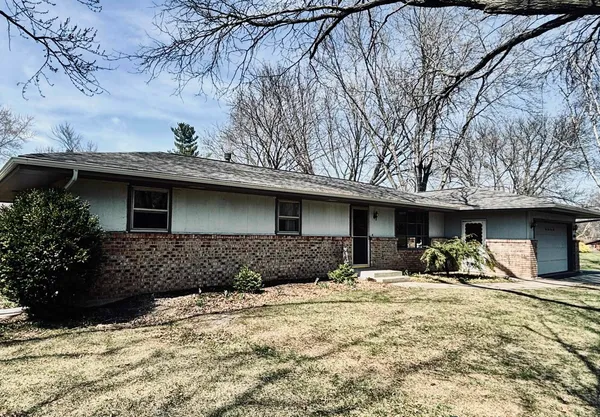 a front view of a house with parking
