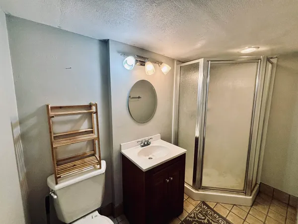 a room with a wooden floor and mirror