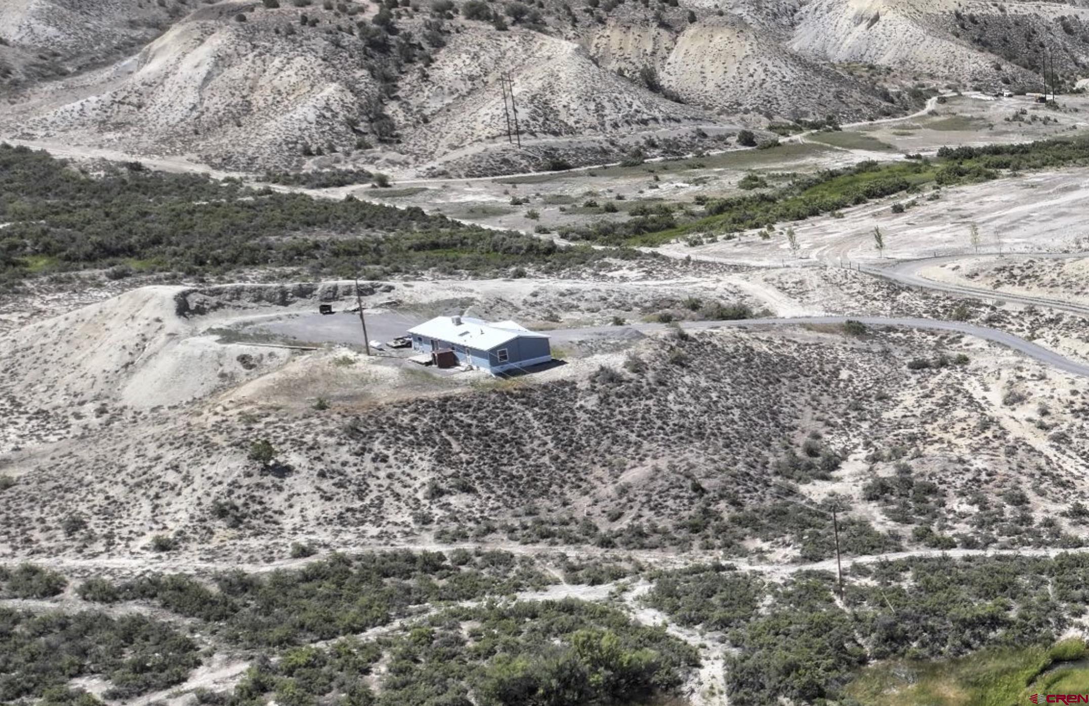 68504 Kinikin Road Montrose, CO 81403 - Photo 1 of 2 a view of a dry field with trees