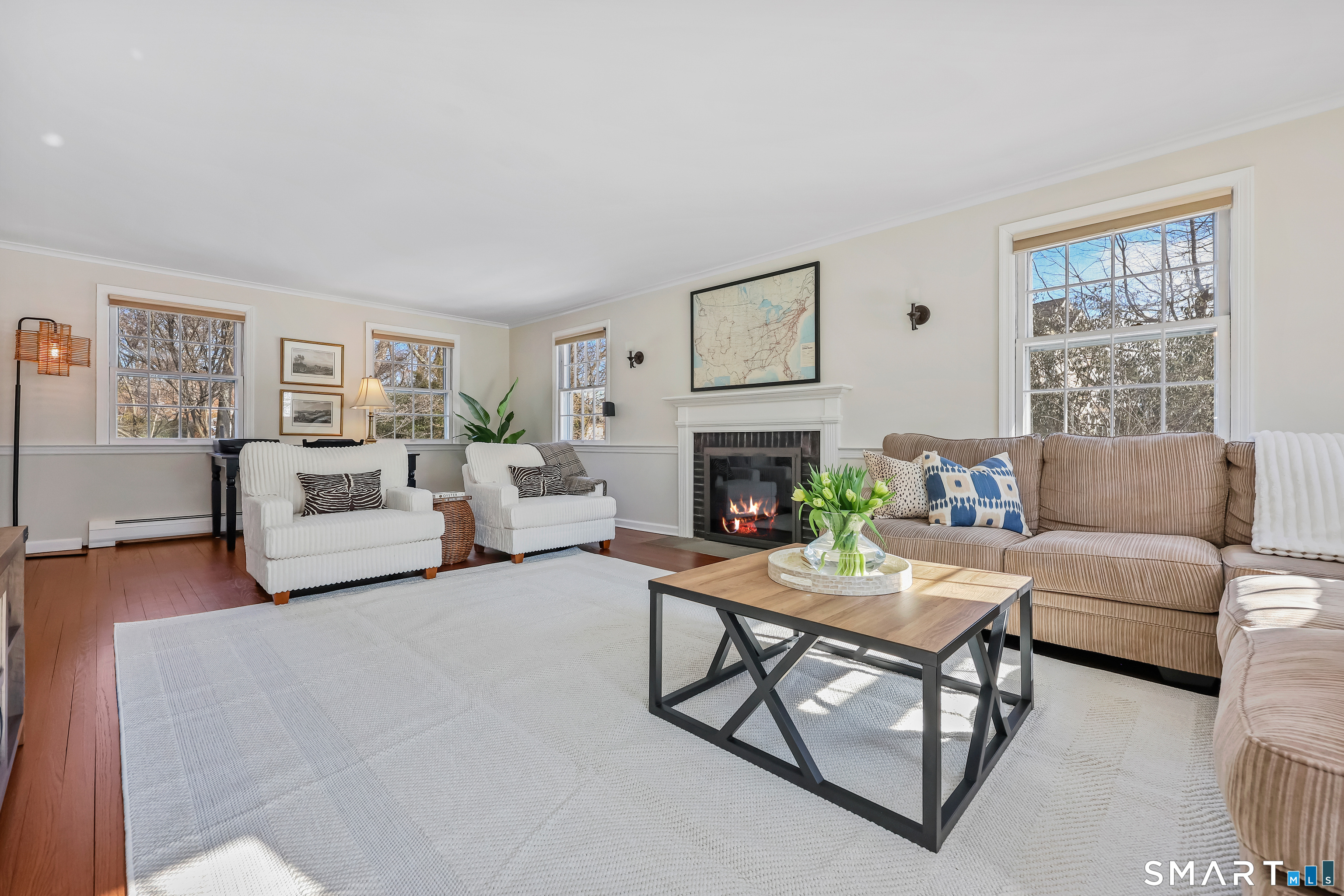 610 Unquowa Road Fairfield, CT 06824 - Photo 11 of 43 a living room with furniture and a fireplace