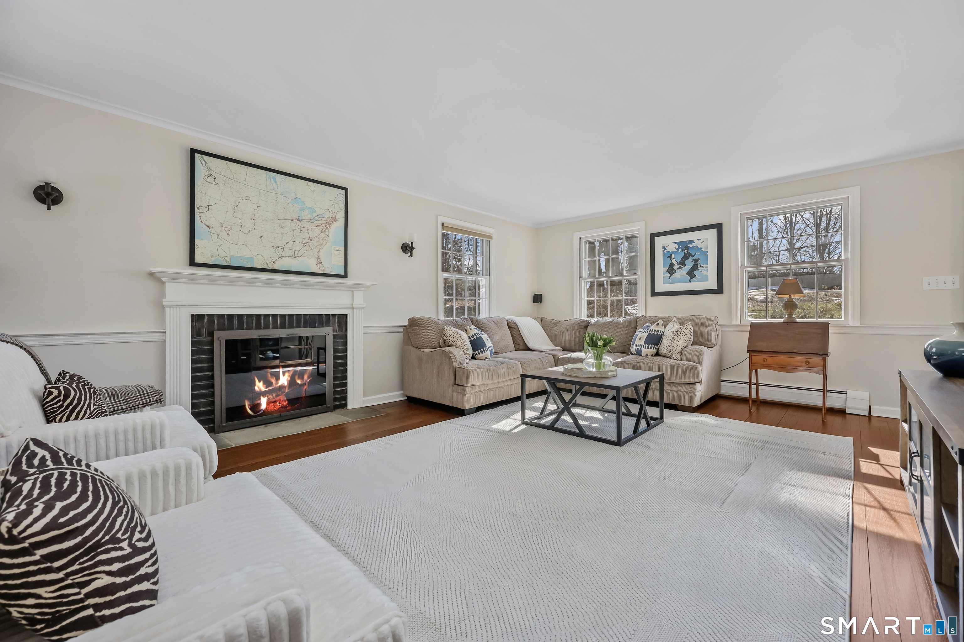 610 Unquowa Road Fairfield, CT 06824 - Photo 13 of 43 a living room with furniture and a fireplace