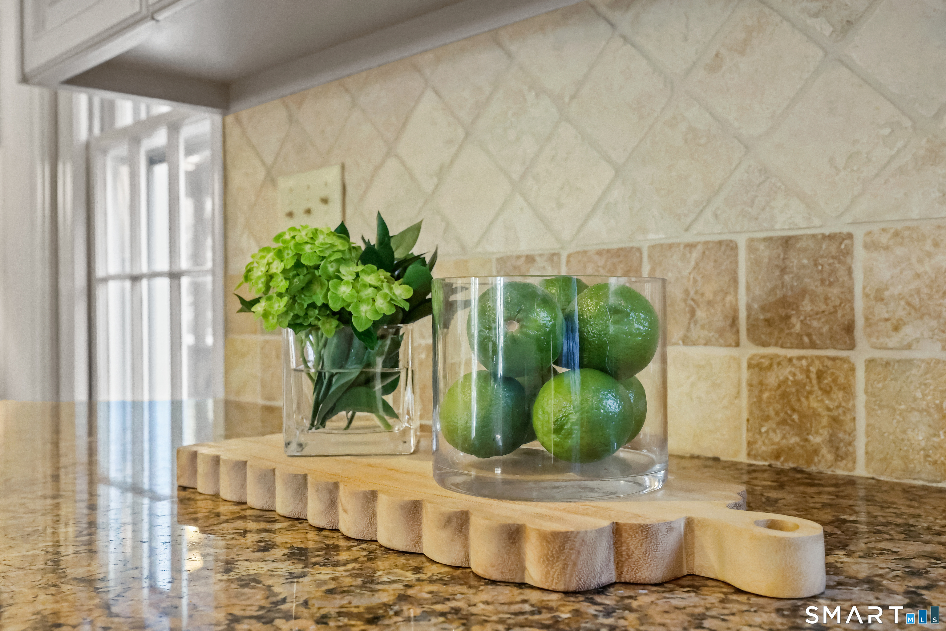 610 Unquowa Road Fairfield, CT 06824 - Photo 18 of 43 a vase of flowers sitting on a table