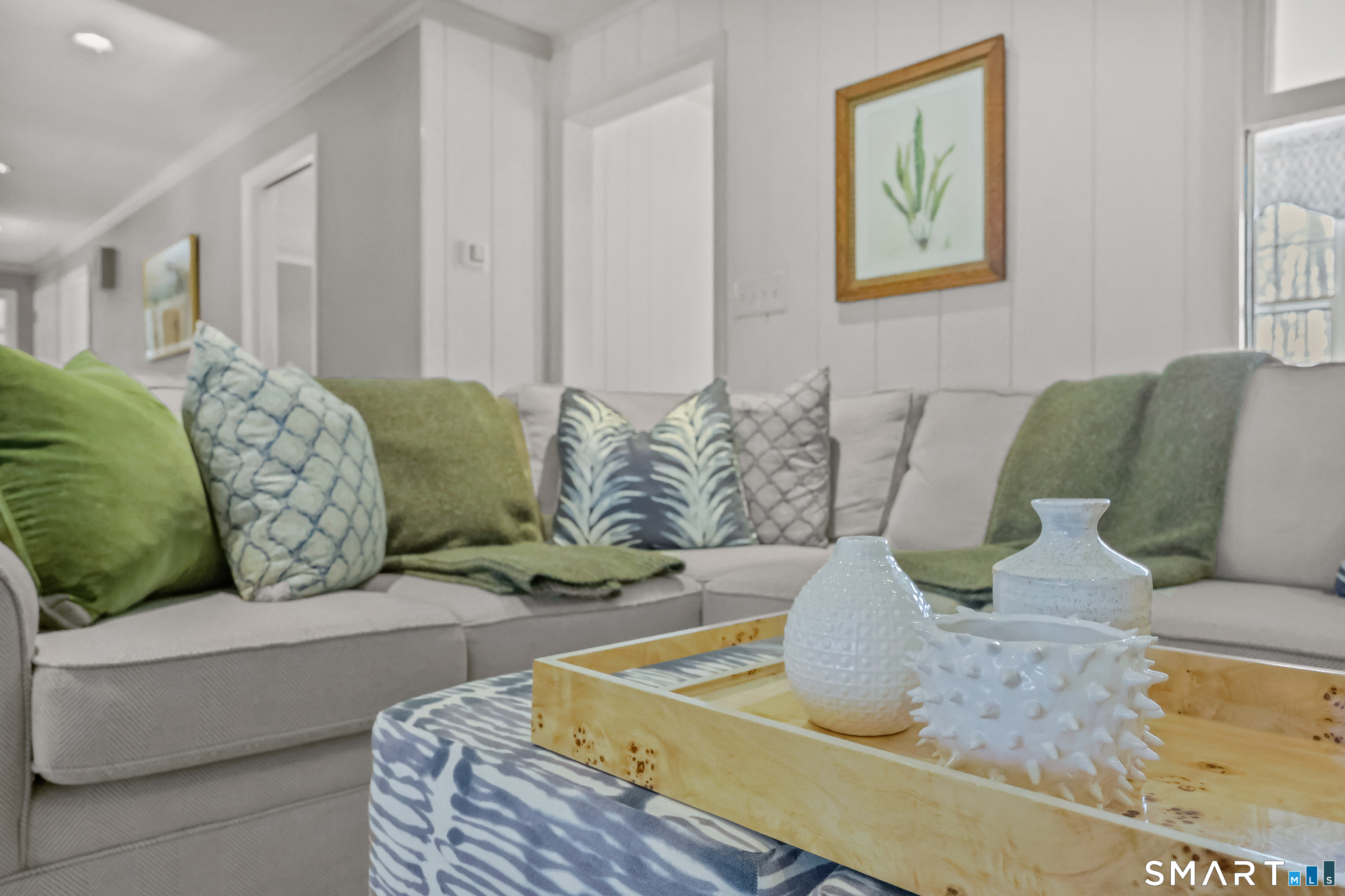 610 Unquowa Road Fairfield, CT 06824 - Photo 22 of 43 a living room with furniture and painting on the wall