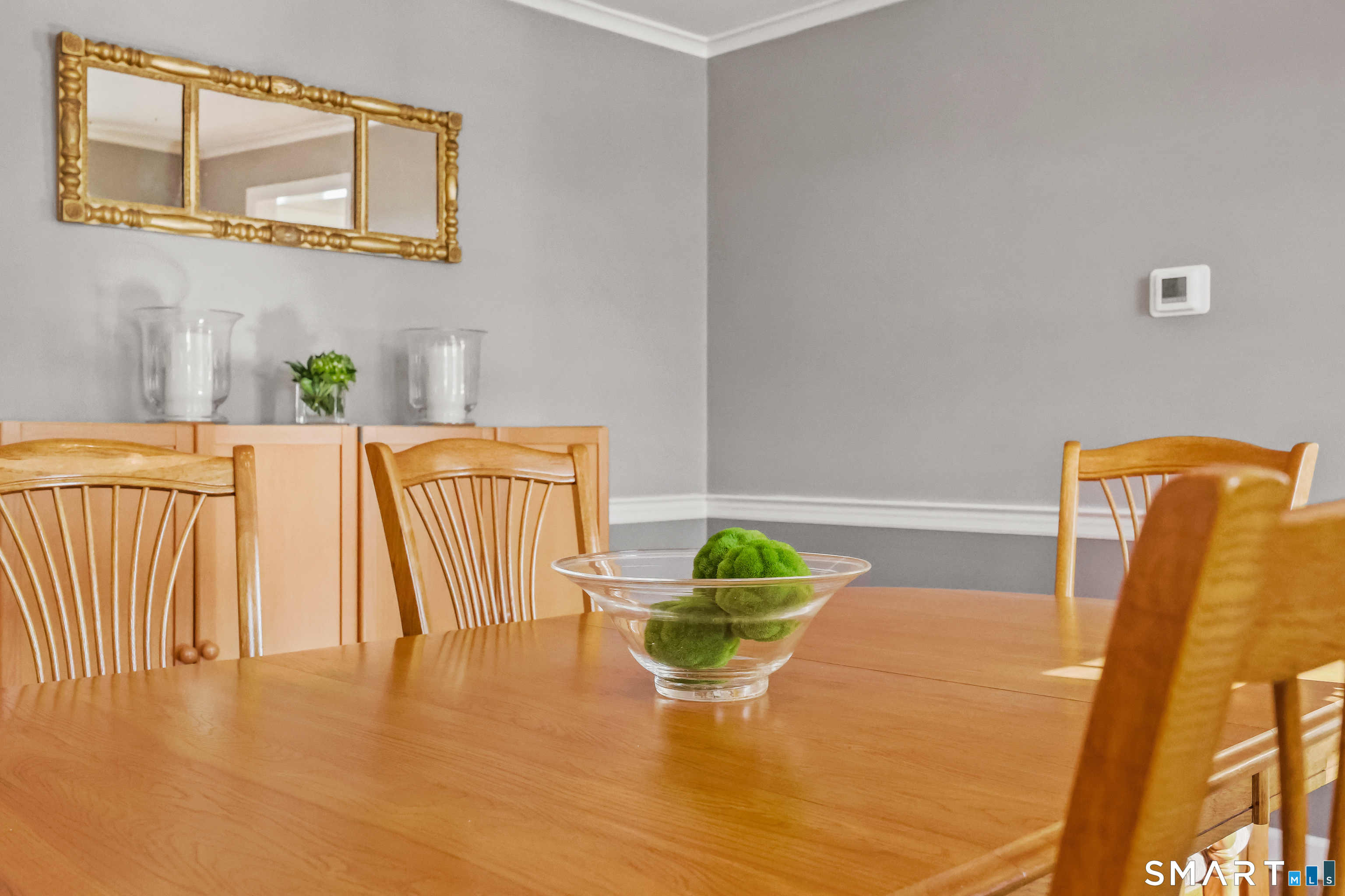 610 Unquowa Road Fairfield, CT 06824 - Photo 26 of 43 a view of a dining room with furniture