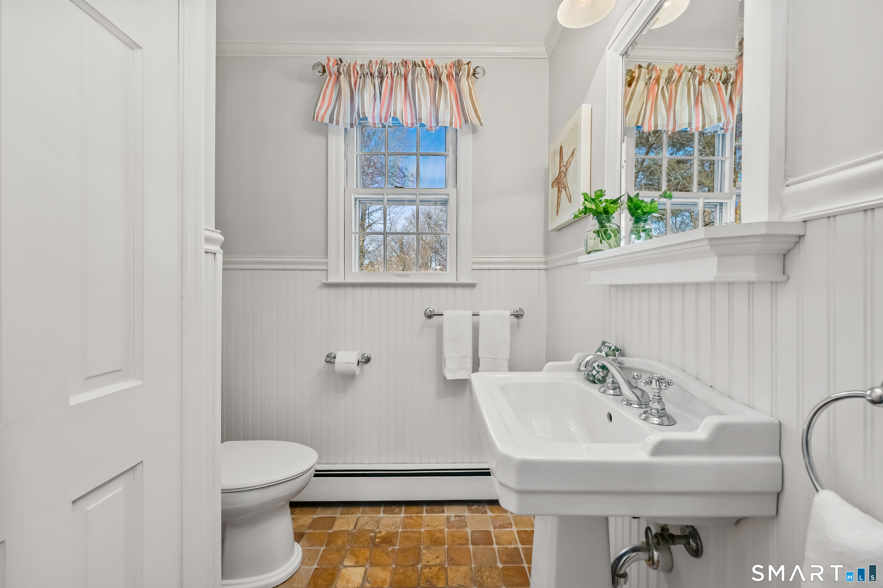 610 Unquowa Road Fairfield, CT 06824 - Photo 28 of 43 a bathroom with a sink and a toilet