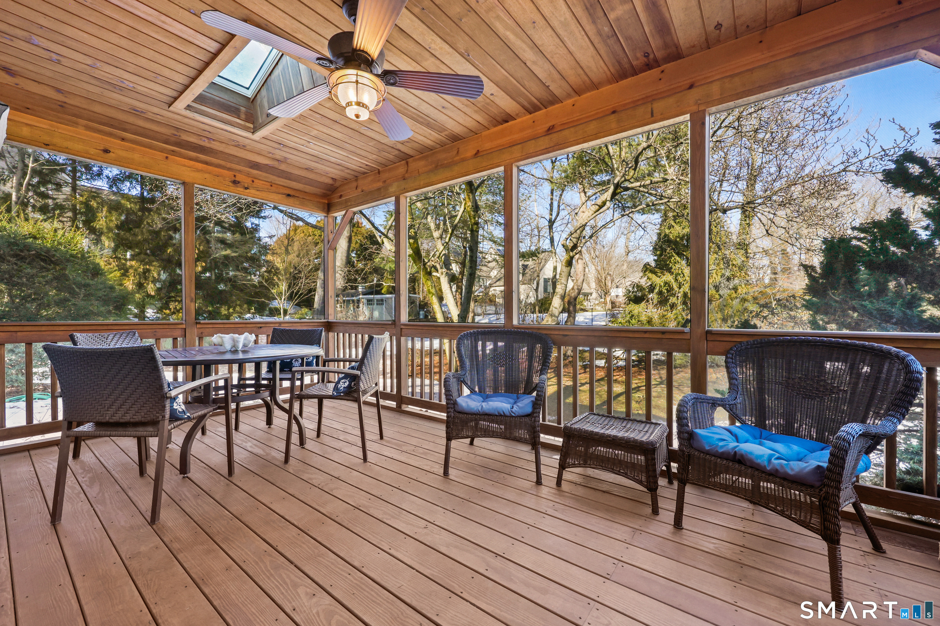 610 Unquowa Road Fairfield, CT 06824 - Photo 29 of 43 a view of a chairs and table on the wooden floor